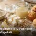 Ingredienti per sostituire le uova in cucina vegetale: semi di lino, banana, tofu e acquafaba su un tavolo